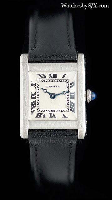 cartier tank watch black face