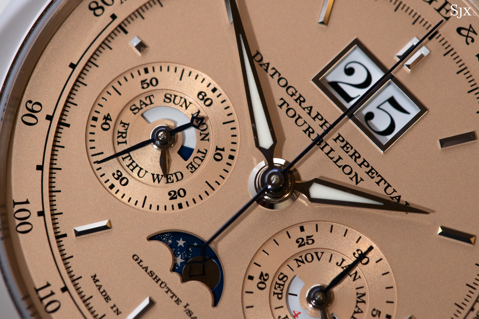 Visible at 6 o’clock is the gold moonphase disc with delicate, laser etched stars. 